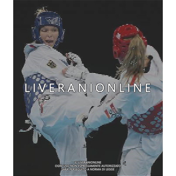 (120810) -- LONDON, Aug. 10, 2012 () -- Helena Fromm of Germany (blue) competes with Carmen Marton of Australia during the bronze medal match of women\'s Taekwondo -67kg event at London 2012 Olympic Games in London, Britain, on August 10, 2012. Helena Fromm of Germany won the match and claimed the bronze medal of the event. (/Wang Lili) AG ALDO LIVERANI S A S ONLY ITALY