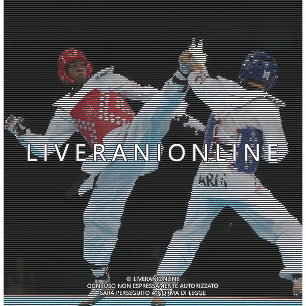 (120810) -- LONDON, Aug. 10, 2012 () -- Lutalo Muhammad of Britain (red) competes with Arman Yeremyan of Armenia during the bronze medal match of men\'s Taekwondo -80kg event at London 2012 Olympic Games in London, Britain, on August 10, 2012. Lutalo Muhammad of Britain won the match and claimed the bronze medal of the event. (/Wang Lili) AG ALDO LIVERANI S A S ONLY ITALY