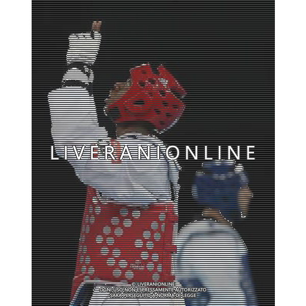 (120810) -- LONDON, Aug. 10, 2012 () -- Lutalo Muhammad of Britain (red) celebrates after winning over Arman Yeremyan of Armenia during the bronze medal match of men\'s Taekwondo -80kg event at London 2012 Olympic Games in London, Britain, on August 10, 2012. Lutalo Muhammad of Britain won the match and claimed the bronze medal of the event. (/Wang Lili) AG ALDO LIVERANI S A S ONLY ITALY