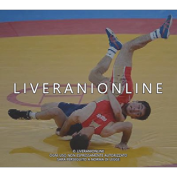 (120810) -- LONDON, Aug. 10, 2012 () -- Dzhamal Otarsultanov of Russia (red) competes with Vladimer Khinchegashvili of Georgia during the gold medal match of men\'s freestyle 55kg of Wrestling event at London 2012 Olympic Games in London, Britain, on August 10, 2012. Dzhamal Otarsultanov of Russia won the match and claimed the gold medal of the event. (/Guo Yong) (nxl) AG ALDO LIVERANI S A S ONLY ITALY