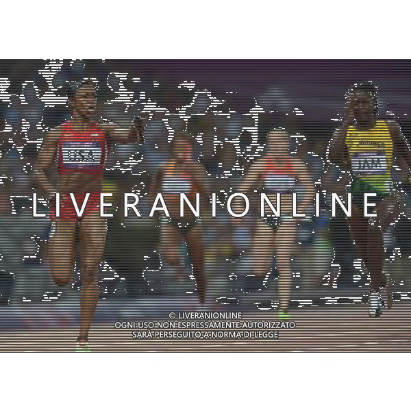 (120810) -- LONDON, Aug. 10, 2012 () -- Carmelita Jeter of U.S. runs across finish line during women\'s 4x100m relay final at London 2012 Olympic Games, London, Britain, Aug. 10, 2012. The U.S. team won gold medal in this event with a new world record of 40.82. (/Li Gang)(zgp) AG ALDO LIVERANI S A S ONLY ITALY