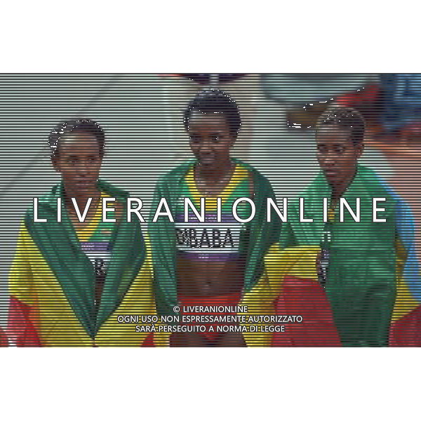 (120810) -- LONDON, Aug. 10, 2012 () -- Meseret Defar (L), Tirunesh Dibaba (C) and Gelete Burka of Ethiopia celebrate after women\'s 5000m final at London 2012 Olympic Games, London, Britain, Aug. 10, 2012. Meseret Defar won gold medal with 15:04.25. (/Gong Lei)(zgp) ©photoshot/Agenzia Aldo Liverani Sas - ITALY ONLY - GIOCHI OLIMPICI, OLIMPIADI LONDRA 2012