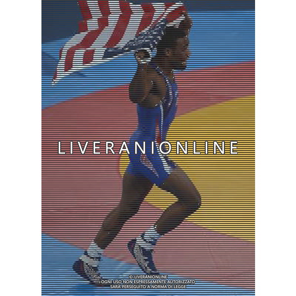 (120810) -- LONDON, Aug. 10, 2012 () -- Jordan Ernest Burroughs of USA (in blue) celebrates after defeating Sadegh Saeed Goudarzi of Iran in men\'s wrestling freestyle 74kg gold medal contest, at London 2012 Olympic Games in London, Britain, on August 10, 2012. Jordan Ernest Burroughs of USA won gold medal. (/Guo Yong) (nxl) ©photoshot/Agenzia Aldo Liverani Sas - ITALY ONLY - GIOCHI OLIMPICI, OLIMPIADI LONDRA 2012