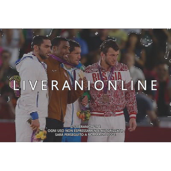 (120810) -- LONDON, Aug. 10, 2012 () -- Gold medalist Jordan Ernest Burroughs of USA (2nd L), silver medalist Sadegh Saeed Goudarzi of Iran (1st L) and bronze medalists Soslan Tigiev of Uzbekistan (2nd R) and Denis Tsargush of Russia attend victory ceremony of men\'s wrestling freestyle 74kg contest, at London 2012 Olympic Games in London, Britain, on August 10, 2012. (/Jin Liwang) (nxl) ©photoshot/Agenzia Aldo Liverani Sas - ITALY ONLY - GIOCHI OLIMPICI, OLIMPIADI LONDRA 2012
