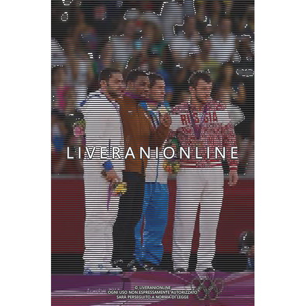 (120810) -- LONDON, Aug. 10, 2012 () -- Gold medalist Jordan Ernest Burroughs of USA (2nd R), silver medalist Sadegh Saeed Goudarzi of Iran (1st L) and bronze medalists Soslan Tigiev of Uzbekistan (2nd R) and Denis Tsargush of Russia attend victory ceremony of men\'s wrestling freestyle 74kg contest, at London 2012 Olympic Games in London, Britain, on August 10, 2012. (/Jin Liwang) (nxl) ©photoshot/Agenzia Aldo Liverani Sas - ITALY ONLY - GIOCHI OLIMPICI, OLIMPIADI LONDRA 2012