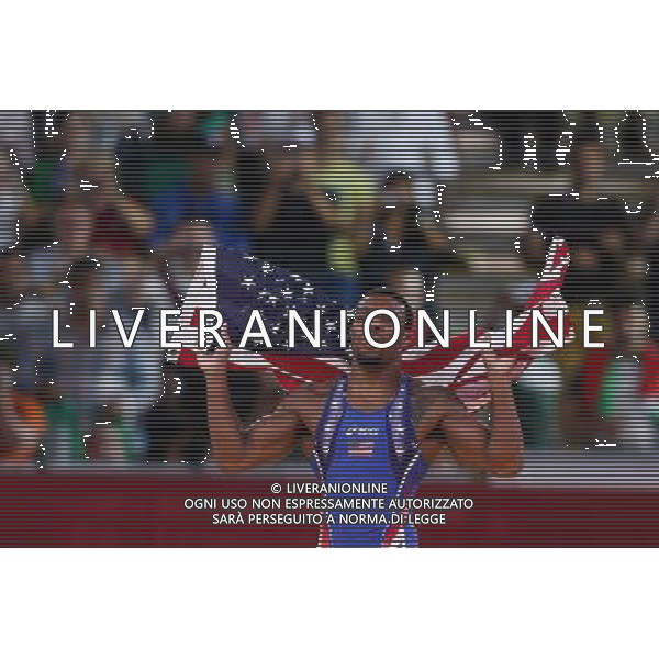 (120810) -- LONDON, Aug. 10, 2012 () -- Jordan Ernest Burroughs of USA (in blue) celebrates after defeating Sadegh Saeed Goudarzi of Iran in men\'s wrestling freestyle 74kg gold medal contest, at London 2012 Olympic Games in London, Britain, on August 10, 2012. Jordan Ernest Burroughs of USA won gold medal. (/Jin Liwang) (nxl) ©photoshot/Agenzia Aldo Liverani Sas - ITALY ONLY - GIOCHI OLIMPICI, OLIMPIADI LONDRA 2012