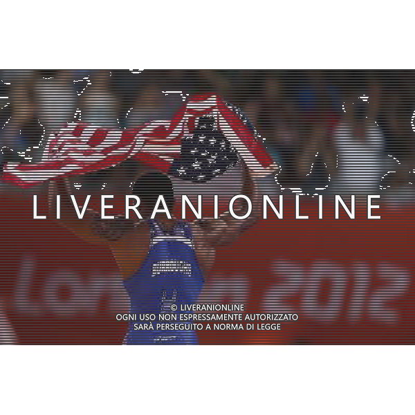 (120810) -- LONDON, Aug. 10, 2012 () -- Jordan Ernest Burroughs of USA (in blue) celebrates after defeating Sadegh Saeed Goudarzi of Iran in men\'s wrestling freestyle 74kg gold medal contest, at London 2012 Olympic Games in London, Britain, on August 10, 2012. Jordan Ernest Burroughs of USA won gold medal. (/Jin Liwang) (nxl) ©photoshot/Agenzia Aldo Liverani Sas - ITALY ONLY - GIOCHI OLIMPICI, OLIMPIADI LONDRA 2012