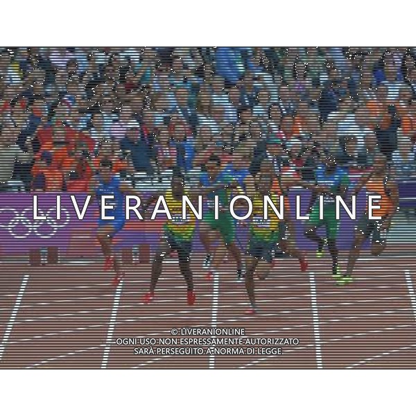 (120810) -- LONDON, Aug. 10, 2012 () -- Yohan Blake and Kemar Bailey-Cole of Jamaica hand over baton during men\'s 4x100m relay heat at London 2012 Olympic Games, London, Britain, Aug. 10, 2012. The Jamaican team advanced to final. (/Gong Lei)(zgp) ©photoshot/Agenzia Aldo Liverani Sas - ITALY ONLY - GIOCHI OLIMPICI, OLIMPIADI LONDRA 2012