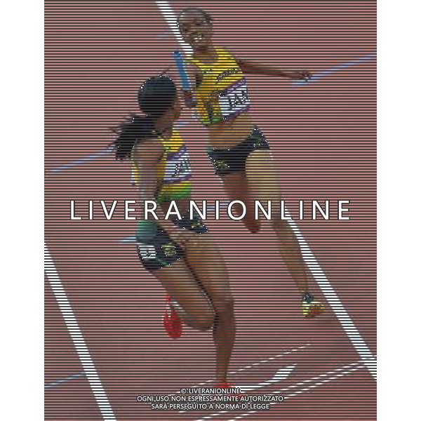(120810) -- LONDON, Aug. 10, 2012 () -- Jamaican runners compete during women\'s 4x400m relay heat at London 2012 Olympic Games, London, Britain, Aug. 10, 2012. The Jamaican team advanced to final. (/Gong Lei)(zgp) ©photoshot/Agenzia Aldo Liverani Sas - ITALY ONLY - GIOCHI OLIMPICI, OLIMPIADI LONDRA 2012