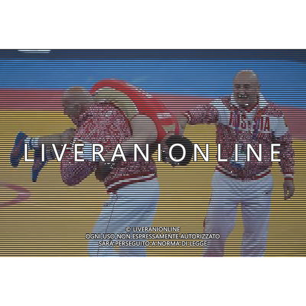 (120810) -- LONDON, Aug. 10, 2012 () -- Dzhamal Otarsultanov of Russia celebrates with his coach after defeating Vladimer Khinchegashvili of Georgia in men\'s wrestling freestyle 55kg gold medal contest, at London 2012 Olympic Games in London, Britain, on August 10, 2012. Dzhamal Otarsultanov of Russia won gold medal. (/Guo Yong) (nxl) ©photoshot/Agenzia Aldo Liverani Sas - ITALY ONLY - GIOCHI OLIMPICI, OLIMPIADI LONDRA 2012