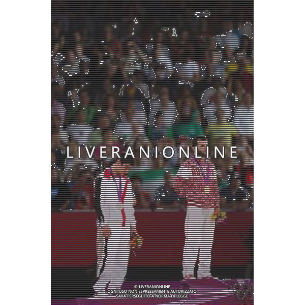 (120810) -- LONDON, Aug. 10, 2012 () -- Gold medalist Dzhamal Otarsultanov of Russia (R) and silver medalist Vladimer Khinchegashvili of Georgia attend victory ceremony of men\'s wrestling freestyle 55kg contest, at London 2012 Olympic Games in London, Britain, on August 10, 2012. (/Jin Liwang) (nxl) ©photoshot/Agenzia Aldo Liverani Sas - ITALY ONLY - GIOCHI OLIMPICI, OLIMPIADI LONDRA 2012