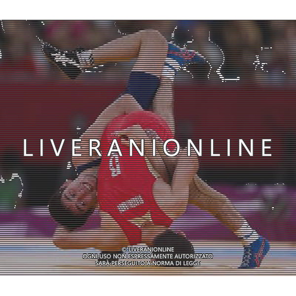 (120810) -- LONDON, Aug. 10, 2012 () -- Dzhamal Otarsultanov of Russia (in red) competes with Vladimer Khinchegashvili of Georgia during men\'s wrestling freestyle 55kg gold medal contest, at London 2012 Olympic Games in London, Britain, on August 10, 2012. Dzhamal Otarsultanov of Russia won gold medal. (/Jin Liwang) (nxl) ©photoshot/Agenzia Aldo Liverani Sas - ITALY ONLY - GIOCHI OLIMPICI, OLIMPIADI LONDRA 2012