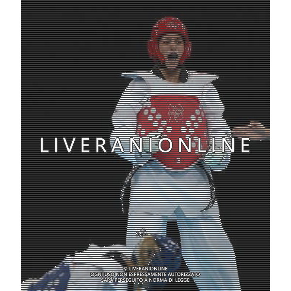 (120810) -- LONDON, Aug. 10, 2012 () -- Nur Tatar (red) of Turkey competes with Carmen Marton of Australia during women\'s -67 kg taekwondo semifinal at London 2012 Olympic Games, London, Britain, Aug. 10, 2012. Nur Tatar won the match 6-0 and advanced to final. (/Wang Lili)(zgp) ©photoshot/Agenzia Aldo Liverani Sas - ITALY ONLY - GIOCHI OLIMPICI, OLIMPIADI LONDRA 2012