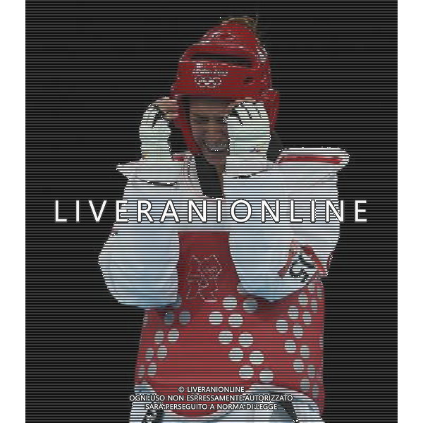 (120810) -- LONDON, Aug. 10, 2012 () -- Nur Tatar (red) of Turkey competes with Carmen Marton of Australia during women\'s -67 kg taekwondo semifinal at London 2012 Olympic Games, London, Britain, Aug. 10, 2012. Nur Tatar won the match 6-0 and advanced to final. (/Wang Lili)(zgp) ©photoshot/Agenzia Aldo Liverani Sas - ITALY ONLY - GIOCHI OLIMPICI, OLIMPIADI LONDRA 2012