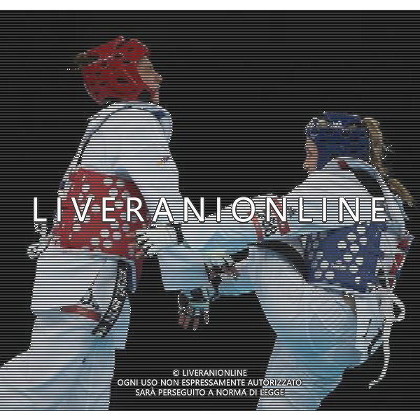 (120810) -- LONDON, Aug. 10, 2012 () -- Nur Tatar (red) of Turkey competes with Carmen Marton of Australia during women\'s -67 kg taekwondo semifinal at London 2012 Olympic Games, London, Britain, Aug. 10, 2012. Nur Tatar won the match 6-0 and advanced to final. (/Wang Lili)(zgp) ©photoshot/Agenzia Aldo Liverani Sas - ITALY ONLY - GIOCHI OLIMPICI, OLIMPIADI LONDRA 2012