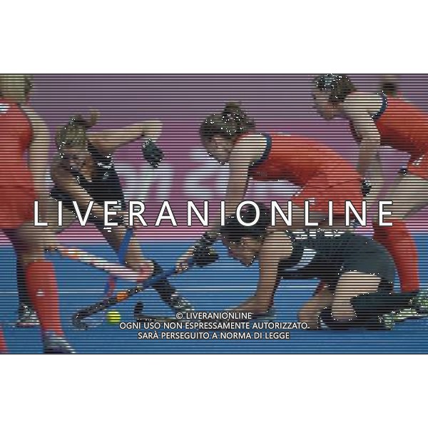 (120810) -- LONDON, Aug. 10, 2012 () -- Emily Maguire (2nd R, in red) vies with Melody Cooper and Krystal Forgeson (2nd L) of New Zealand during the women\'s hockey bronze medal match between New Zealand and Britain at London 2012 Olympic Games, London, Britain, Aug. 10, 2012. Britain won the match 3-1 and claimed the bronze medal of the event. (/Wang Yuguo) ©photoshot/Agenzia Aldo Liverani Sas - ITALY ONLY - GIOCHI OLIMPICI, OLIMPIADI LONDRA 2012