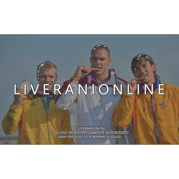 (120810) -- LONDON, Aug. 10, 2012 () -- Gold medalist Maris Strombergs of Latvia (C), silver medalist Sam Willoughby of Australia (L) and bronze medalist Carlos Mario Oquendo Zabala of Colombia attend victory ceremony of men\'s cycling BMX competition, at London 2012 Olympic Games in London, Britain, on August 10, 2012. (/Cheng Min) (nxl) ©photoshot/Agenzia Aldo Liverani Sas - ITALY ONLY - GIOCHI OLIMPICI, OLIMPIADI LONDRA 2012