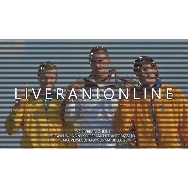 (120810) -- LONDON, Aug. 10, 2012 () -- Gold medalist Maris Strombergs of Latvia (C), silver medalist Sam Willoughby of Australia (L) and bronze medalist Carlos Mario Oquendo Zabala of Colombia attend victory ceremony of men\'s cycling BMX competition, at London 2012 Olympic Games in London, Britain, on August 10, 2012. (/Cheng Min) (nxl) ©photoshot/Agenzia Aldo Liverani Sas - ITALY ONLY - GIOCHI OLIMPICI, OLIMPIADI LONDRA 2012