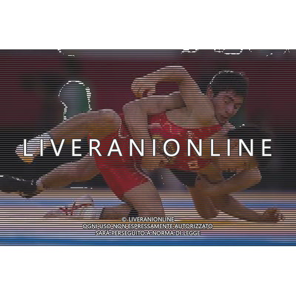 (120810) -- LONDON, Aug. 10, 2012 () -- Vladimer Khinchegashvili of Georgia (in blue) competes with Shinichi Yumoto of Japan during men\'s wrestling freestyle 55kg contest, at London 2012 Olympic Games in London, Britain, on August 10, 2012. Vladimer Khinchegashvili of Georgia won. (/Jin Liwang) (nxl) ©photoshot/Agenzia Aldo Liverani Sas - ITALY ONLY - GIOCHI OLIMPICI, OLIMPIADI LONDRA 2012