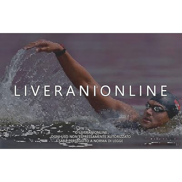 (120810) -- LONDON, Aug. 10, 2012 () -- Oussama Mellouli of Tunisia takes part in men\'s swimming 10km marathon, at London 2012 Olympic Games in London, Britain, on August 10, 2012. Oussama Mellouli of Tunisia won gold medal. (/Chen Xiaowei) (nxl) ITALY ONLY - GIOCHI OLIMPICI, OLIMPIADI LONDRA 2012