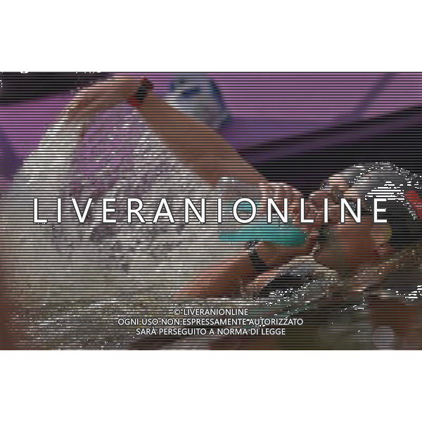 (120810) -- LONDON, Aug. 10, 2012 () -- Oussama Mellouli of Tunisia takes part in men\'s swimming 10km marathon, at London 2012 Olympic Games in London, Britain, on August 10, 2012. Oussama Mellouli of Tunisia won gold medal. (/Chen Xiaowei) (nxl) ITALY ONLY - GIOCHI OLIMPICI, OLIMPIADI LONDRA 2012