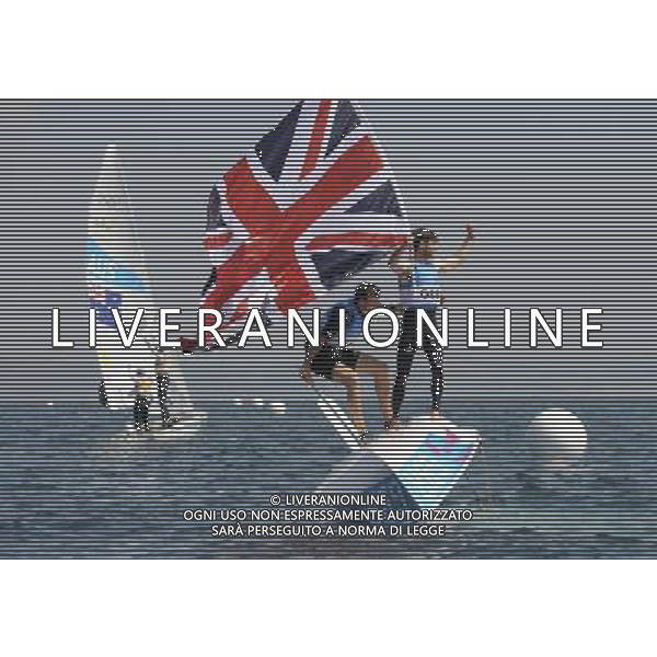 (120810) -- WEYMOUTH, Aug. 10, 2012 () -- Luke Patience (R)/Stuart Bithell of Britain celebrate after 470 men competition of sailing event, at London 2012 Olympic Games in Weymouth and Portland, Britain, August 10, 2012. Mathew Belcher/Malcolm Page of Australia won gold medal. Luke Patience/Stuart Bithell of Britain won silve medal. (/Zeng Yi) (zgp) ITALY ONLY - GIOCHI OLIMPICI, OLIMPIADI LONDRA 2012