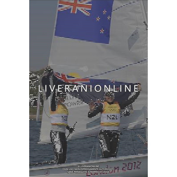 (120810) -- WEYMOUTH, Aug. 10, 2012 () -- Jo Aleh (L)/Olivia Powrie of New Zealand celebrate after 470 women competition of sailing event, at London 2012 Olympic Games in Weymouth and Portland, Britain, August 10, 2012. Jo Aleh/Olivia Powrie of New Zealand won gold medal. (/Zeng Yi) (zgp) ITALY ONLY - GIOCHI OLIMPICI, OLIMPIADI LONDRA 2012