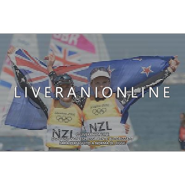 (120810) -- WEYMOUTH, Aug. 10, 2012 () -- Jo Aleh (L)/Olivia Powrie of New Zealand celebrate after 470 women competition of sailing event, at London 2012 Olympic Games in Weymouth and Portland, Britain, August 10, 2012. Jo Aleh/Olivia Powrie of New Zealand won gold medal. (/Zeng Yi) (zgp) ITALY ONLY - GIOCHI OLIMPICI, OLIMPIADI LONDRA 2012