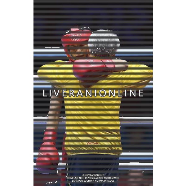 (120810) -- LONDON, Aug. 10, 2012 () -- Zou Shiming of China (in red) hugs coach Wang Chuanliang before men\'s Light Fly (46-49kg) semifinals match between him and Paddy Barnes of Ireland, at London 2012 Olympic Games in London, Britain, on August 10, 2012. Zou Shiming of China advanced to the final. (/Wang Shen) (nxl) ITALY ONLY - GIOCHI OLIMPICI, OLIMPIADI LONDRA 2012