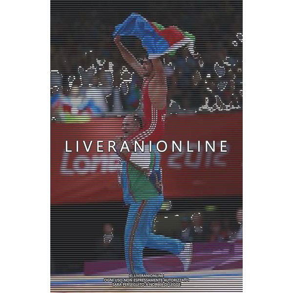 (120811) -- LONDON, Aug. 11, 2012 () -- Toghrul Asgarov of Azerbaijan (red) celebrates after winning over Besik Kudukhov of Russia during the Men\'s 60kg Freestyle gold medal match of Wrestling at London 2012 Olympic Games, London, Britain, Aug. 11, 2012. Toghrul Asgarov of Azerbaijan won the match and claimed the gold medal of the event. (/Ren Zhenglai) ITALY ONLY - GIOCHI OLIMPICI, OLIMPIADI LONDRA 2012
