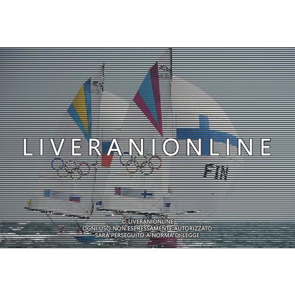 (120811) -- LONDON, Aug. 11, 2012 () -- The Finnish team competes with the Russian team during Elliott 6m WMR competition of Sailing event, at London 2012 Olympic Games in Britain, on August 11, 2012. The Finnish team won bronze medal. (/Zeng Yi) (nxl) ITALY ONLY - GIOCHI OLIMPICI, OLIMPIADI LONDRA 2012