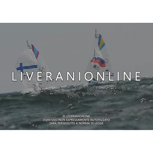 (120811) -- LONDON, Aug. 11, 2012 () -- The Finnish team competes with the Russian team during Elliott 6m WMR competition of Sailing event, at London 2012 Olympic Games in Britain, on August 11, 2012. The Finnish team won bronze medal. (/Zeng Yi) (nxl) ITALY ONLY - GIOCHI OLIMPICI, OLIMPIADI LONDRA 2012