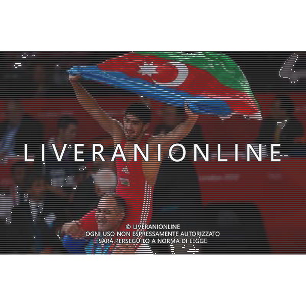 (120811) -- LONDON, Aug. 11, 2012 () -- Toghrul Asgarov of Azerbaijan (red) celebrates after winning over Besik Kudukhov of Russia during the Men\'s 60kg Freestyle gold medal match of Wrestling at London 2012 Olympic Games, London, Britain, Aug. 11, 2012. Toghrul Asgarov of Azerbaijan won the match and claimed the gold medal of the event. (/Jin Liwang) ITALY ONLY - GIOCHI OLIMPICI, OLIMPIADI LONDRA 2012