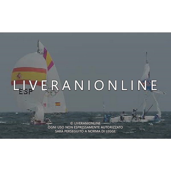 (120811) -- LONDON, Aug. 11, 2012 () -- The Spanish team competes with the Australian team during Elliott 6m WMR competition of Sailing event, at London 2012 Olympic Games in Britain, on August 11, 2012. The Spanish team won gold medal. (/Zeng Yi) (nxl) ITALY ONLY - GIOCHI OLIMPICI, OLIMPIADI LONDRA 2012