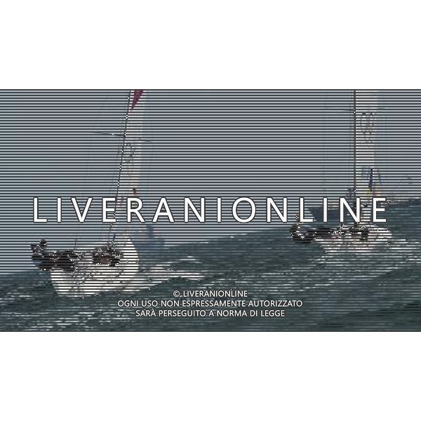 (120811) -- LONDON, Aug. 11, 2012 () -- Members of the Spanish team (L) competes with the Australian team during Elliott 6m WMR competition of Sailing event, at London 2012 Olympic Games in Britain, on August 11, 2012. The Spanish team won gold medal. (/Zeng Yi) (nxl) ITALY ONLY - GIOCHI OLIMPICI, OLIMPIADI LONDRA 2012