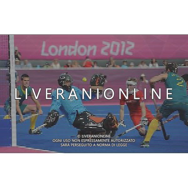 (120811) -- LONDON, Aug. 11, 2012 () -- Britain goalkeeper James Fair saves the ball during the bronze medal match of men\'s Hockey between Australia and Britain at London 2012 Olympic Games, London, Britain, Aug. 11, 2012. Australia won the match and claimed the bronze medal of the event. (/Wang Yuguo) ITALY ONLY - GIOCHI OLIMPICI, OLIMPIADI LONDRA 2012
