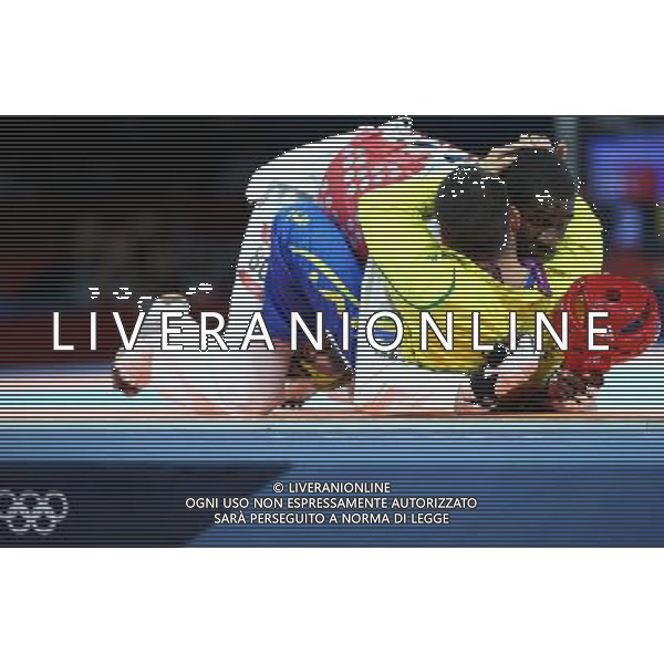 (120811) -- LONDON, Aug. 11, 2012 () -- Anthony Obame of Gabon hugs his coach after defeating Bahri Tanrikulu of Turkey in men\'s Taekwondo +80kg semifinal match, at London 2012 Olympic Games in London, Britain, on August 11, 2012. (/Wang Lili) (nxl) ITALY ONLY - GIOCHI OLIMPICI, OLIMPIADI LONDRA 2012