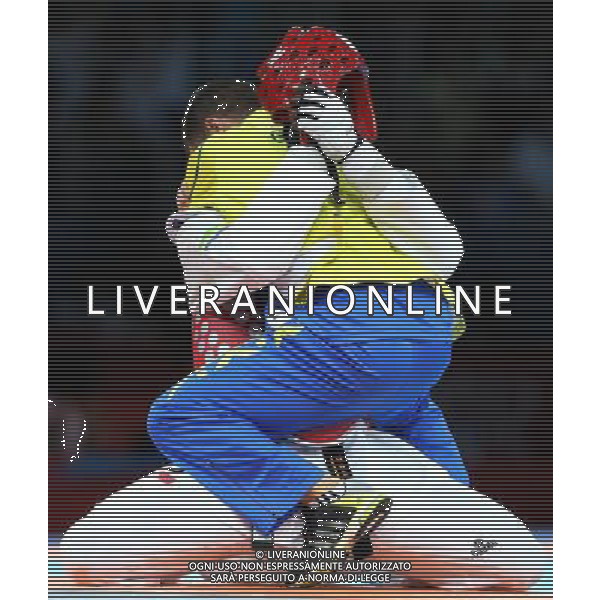 (120811) -- LONDON, Aug. 11, 2012 () -- Anthony Obame of Gabon hugs his coach after defeating Bahri Tanrikulu of Turkey in men\'s Taekwondo +80kg semifinal match, at London 2012 Olympic Games in London, Britain, on August 11, 2012. (/Wang Lili) (nxl) ITALY ONLY - GIOCHI OLIMPICI, OLIMPIADI LONDRA 2012