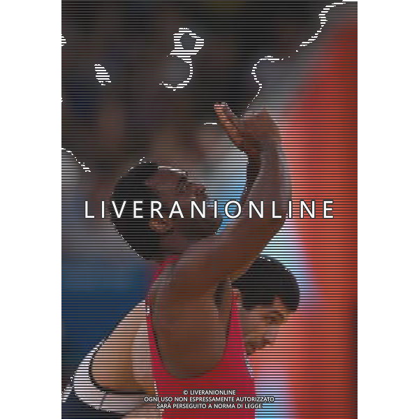 (120811) -- LONDON, Aug. 11, 2012 () -- Jaime Yusept Espinal of Puerto Rico (in red) celebrates after defeating Soslan Gattsiev of Belarus during men\'s wrestling freestyle 84kg semifinal match, at London 2012 Olympic Games in London, Britain, on August 11, 2012. Jaime Yusept Espinal of Puerto Rico won. (/Jin Liwang) (nxl) ©PHOTOSHOT/Agenzia Aldo Liverani Sas - ITALY ONLY - GIOCHI OLIMPICI, OLIMPIADI LONDRA 2012