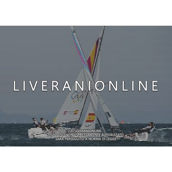 (120811) -- LONDON, Aug. 11, 2012 () -- Members of the Spanish team (L) competes with the Australian team during Elliott 6m WMR competition of Sailing event, at London 2012 Olympic Games in Britain, on August 11, 2012. The Spanish team won gold medal. (/Zeng Yi) (nxl) ©PHOTOSHOT/Agenzia Aldo Liverani Sas - ITALY ONLY - GIOCHI OLIMPICI, OLIMPIADI LONDRA 2012