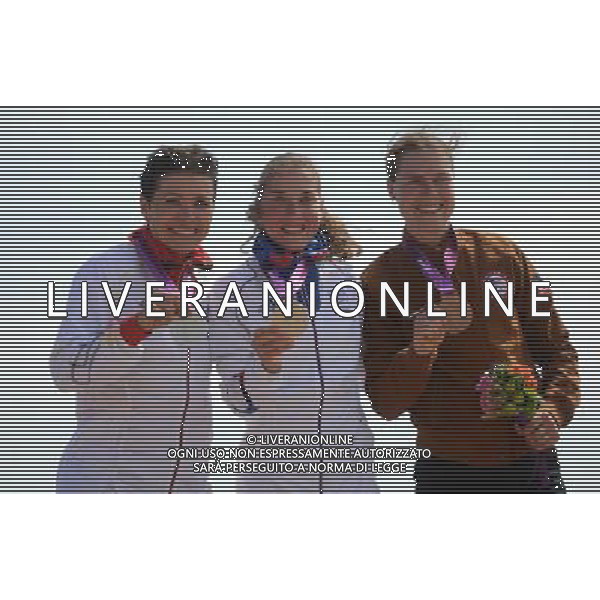 (120811) -- LONDON, Aug. 11, 2012 () -- Gold medalist Julie Bresset of France (C), silver medalist Sabine Spitz of Germany (L) and bronze medalist Georgia Gould of USA attend victory ceremony of women\'s Cross-country competition of Cycling Mountain Bike event, at London 2012 Olympic Games in London, Britain, on August 11, 2012. (/Li Ga) (nxl) ©PHOTOSHOT/Agenzia Aldo Liverani Sas - ITALY ONLY - GIOCHI OLIMPICI, OLIMPIADI LONDRA 2012