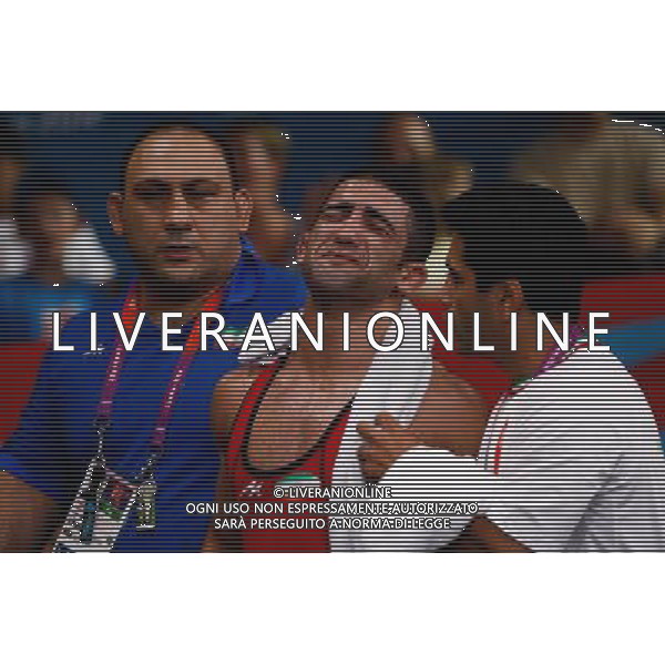 (120811) -- LONDON, Aug. 11, 2012 () -- Masoud Esmaeilpoorjouybari of Iran (C) burst into tears after losing the match against Besik Kudukhov of Russia during the Men\'s 60kg Freestyle quarterfinal of Wrestling at London 2012 Olympic Games, London, Britain, Aug. 11, 2012. Besik Kudukhov of Russia won the match and advanced to semifinal. (/Jin Liwang) ©PHOTOSHOT/Agenzia Aldo Liverani Sas - ITALY ONLY - GIOCHI OLIMPICI, OLIMPIADI LONDRA 2012