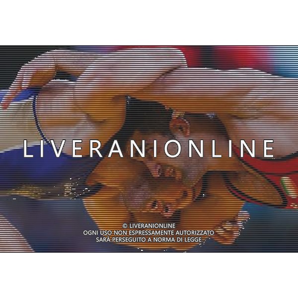 (120811) -- LONDON, Aug. 11, 2012 () -- Besik Kudukhov of Russia (blue) competes with Masoud Esmaeilpoorjouybari of Iran during the Men\'s 60kg Freestyle quarterfinal of Wrestling at London 2012 Olympic Games, London, Britain, Aug. 11, 2012. Besik Kudukhov of Russia won the match and advanced to semifinal. (/Jin Liwang) ©PHOTOSHOT/Agenzia Aldo Liverani Sas - ITALY ONLY - GIOCHI OLIMPICI, OLIMPIADI LONDRA 2012