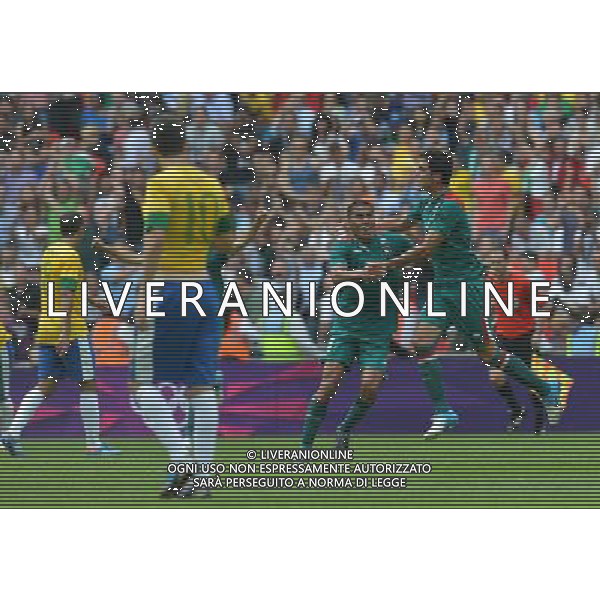 (120811) -- LONDON, Aug. 11, 2012 () -- Mexican players (R) celebrate after men\'s football gold medal match between Brazil and Mexico, at London 2012 Olympic Games in London, Britain, on August 11, 2012. Mexico won the match 2-1 and won gold medal. (/Gong Lei) (zgp) ©PHOTOSHOT/Agenzia Aldo Liverani Sas - ITALY ONLY - GIOCHI OLIMPICI, OLIMPIADI LONDRA 2012