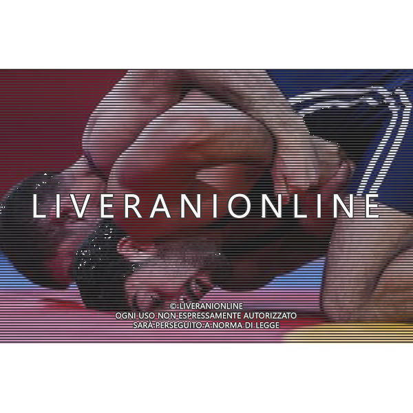 (120811) -- LONDON, Aug. 11, 2012 () -- Toghrul Asgarov of Azerbaijan (blue) competes with Coleman Scott of the United States during the Men\'s 60kg Freestyle semifinal of Wrestling at London 2012 Olympic Games, London, Britain, Aug. 11, 2012. Toghrul Asgarov of Azerbaijan won the match and advanced to final. (/Jin Liwang) ©PHOTOSHOT/Agenzia Aldo Liverani Sas - ITALY ONLY - GIOCHI OLIMPICI, OLIMPIADI LONDRA 2012