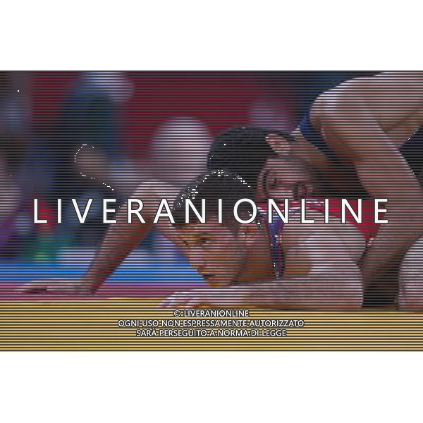 (120811) -- LONDON, Aug. 11, 2012 () -- Toghrul Asgarov of Azerbaijan (blue) competes with Coleman Scott of the United States during the Men\'s 60kg Freestyle semifinal of Wrestling at London 2012 Olympic Games, London, Britain, Aug. 11, 2012. Toghrul Asgarov of Azerbaijan won the match and advanced to final. (/Jin Liwang) ©PHOTOSHOT/Agenzia Aldo Liverani Sas - ITALY ONLY - GIOCHI OLIMPICI, OLIMPIADI LONDRA 2012