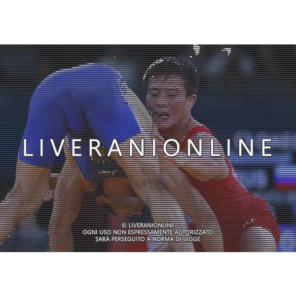 (120811) -- LONDON, Aug. 11, 2012 () -- Besik Kudukhov of Russia (blue) competes with Ri Jong Myong of the Democratic People\'s Republic of Korea (DPRK) during the Men\'s 60kg Freestyle of Wrestling at London 2012 Olympic Games, London, Britain, Aug. 11, 2012. Besik Kudukhov of Russia won the match and advanced to final. (/Ren Zhenglai) ©PHOTOSHOT/Agenzia Aldo Liverani Sas - ITALY ONLY - GIOCHI OLIMPICI, OLIMPIADI LONDRA 2012