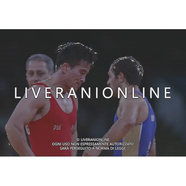 (120811) -- LONDON, Aug. 11, 2012 () -- Ri Jong Myong (front) of the Democratic People\'s Republic of Korea (DPRK) reacts while competing with Besik Kudukhov of Russia during the Men\'s 60kg Freestyle of Wrestling at London 2012 Olympic Games, London, Britain, Aug. 11, 2012. Besik Kudukhov of Russia won the match and advanced to final. (/Ren Zhenglai) ©PHOTOSHOT/Agenzia Aldo Liverani Sas - ITALY ONLY - GIOCHI OLIMPICI, OLIMPIADI LONDRA 2012