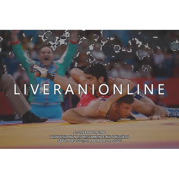 (120811) -- LONDON, Aug. 11, 2012 () -- Toghrul Asgarov of Azerbaijan (blue) competes with Coleman Scott of the United States during the Men\'s 60kg Freestyle semifinal of Wrestling at London 2012 Olympic Games, London, Britain, Aug. 11, 2012. Toghrul Asgarov of Azerbaijan won the match and advanced to final. (/Jin Liwang) ©PHOTOSHOT/Agenzia Aldo Liverani Sas - ITALY ONLY - GIOCHI OLIMPICI, OLIMPIADI LONDRA 2012