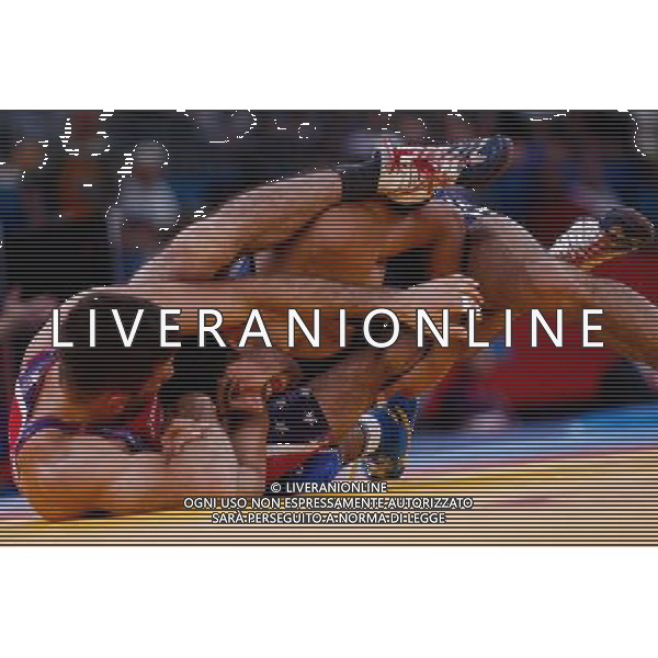 (120811) -- LONDON, Aug. 11, 2012 () -- Toghrul Asgarov of Azerbaijan (blue) competes with Coleman Scott of the United States during the Men\'s 60kg Freestyle semifinal of Wrestling at London 2012 Olympic Games, London, Britain, Aug. 11, 2012. Toghrul Asgarov of Azerbaijan won the match and advanced to final. (/Jin Liwang) ©PHOTOSHOT/Agenzia Aldo Liverani Sas - ITALY ONLY - GIOCHI OLIMPICI, OLIMPIADI LONDRA 2012